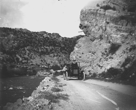 Driving along the Grand Canyon of the Arkansas (now called the Bighorn Sheep Canyon) in the early days of US 50. - via highway50.com