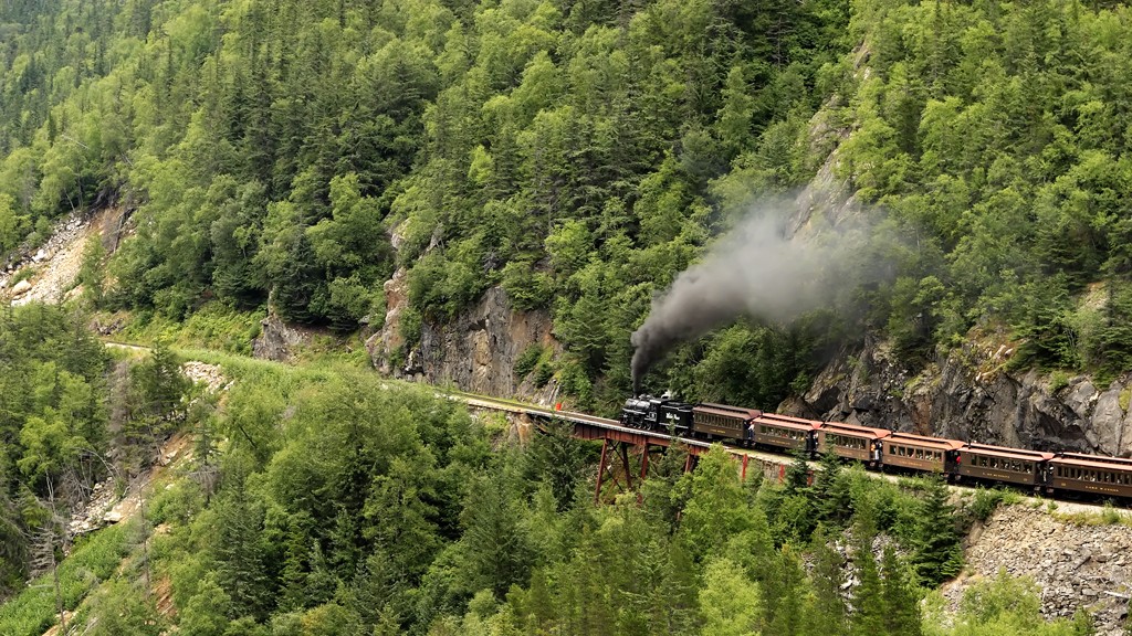 The White Pass and Yukon Railroad Baldwin Steam locomotive #73, climbing a steep grade as it leaves Skagway on it’s round trip to Fraser, YT. Photo by Alan Vernon/Flickr