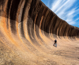 Traveller take photo a Wave rock