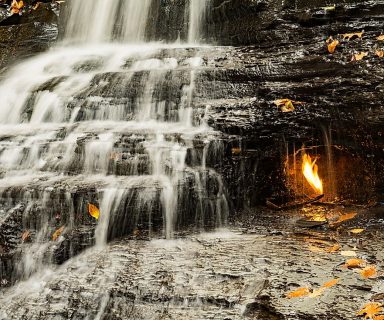 A natural-gas flame burns in a small grotto at the base of Eternal Flame Falls in Chestnut Ridge County Park