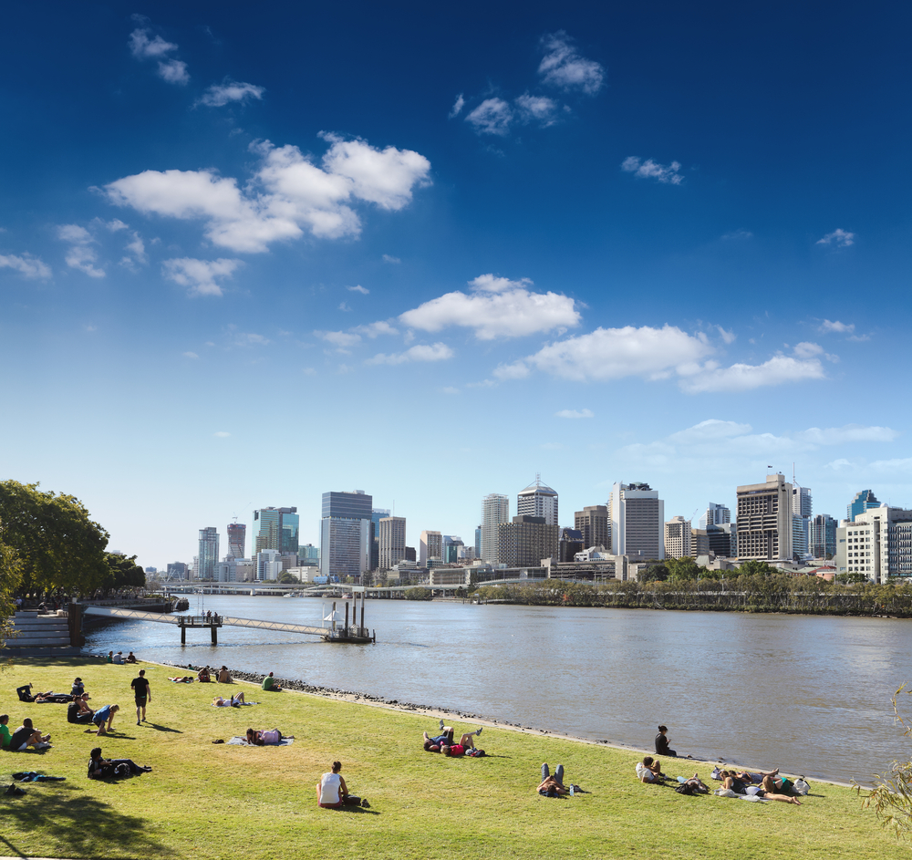 brisbane skyline from the park and people in lawn , queensland, Australia