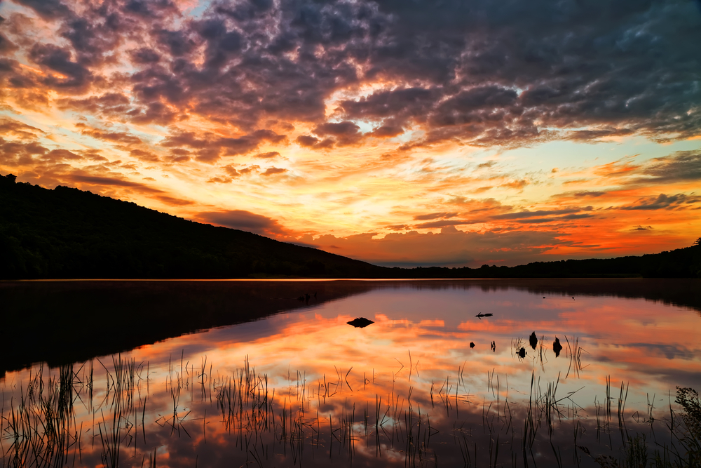 A cloudy sunrise at Locust Lake State Park, Schuylkill County, Pennsylvania, USA.