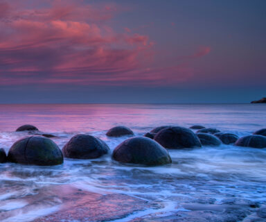 Moeraki boulders afterglow sunset on Koekohe beach, New Zealand