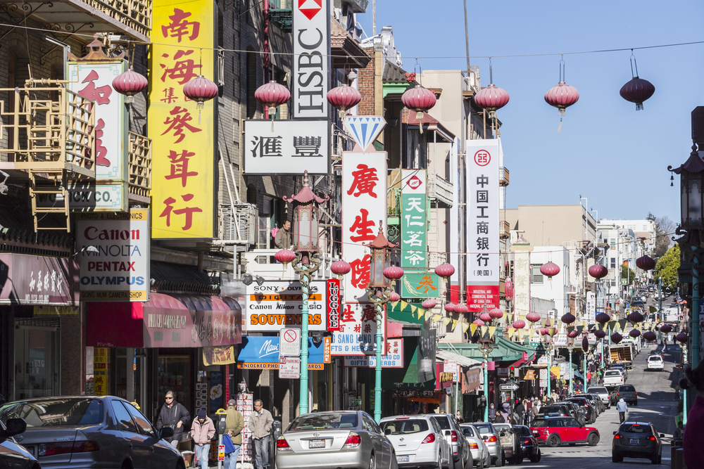 View of shops and signs in San Francisco's popular Chinatown tourist area.